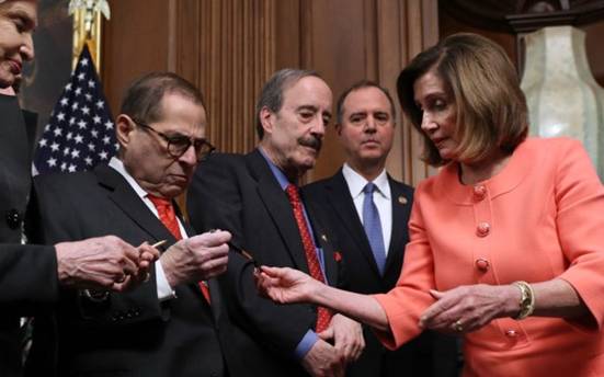 Image result for PELOSI WITH the signed gold pens"