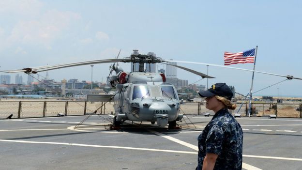 A helicopter stops on the US Navy ship USS Blue Ridge in the Sri Lankan capital Colombo on March 30, 2016. The USS Blue Ridge the command ship of the US Seventh Fleet is in Colombo on a six-day port call.